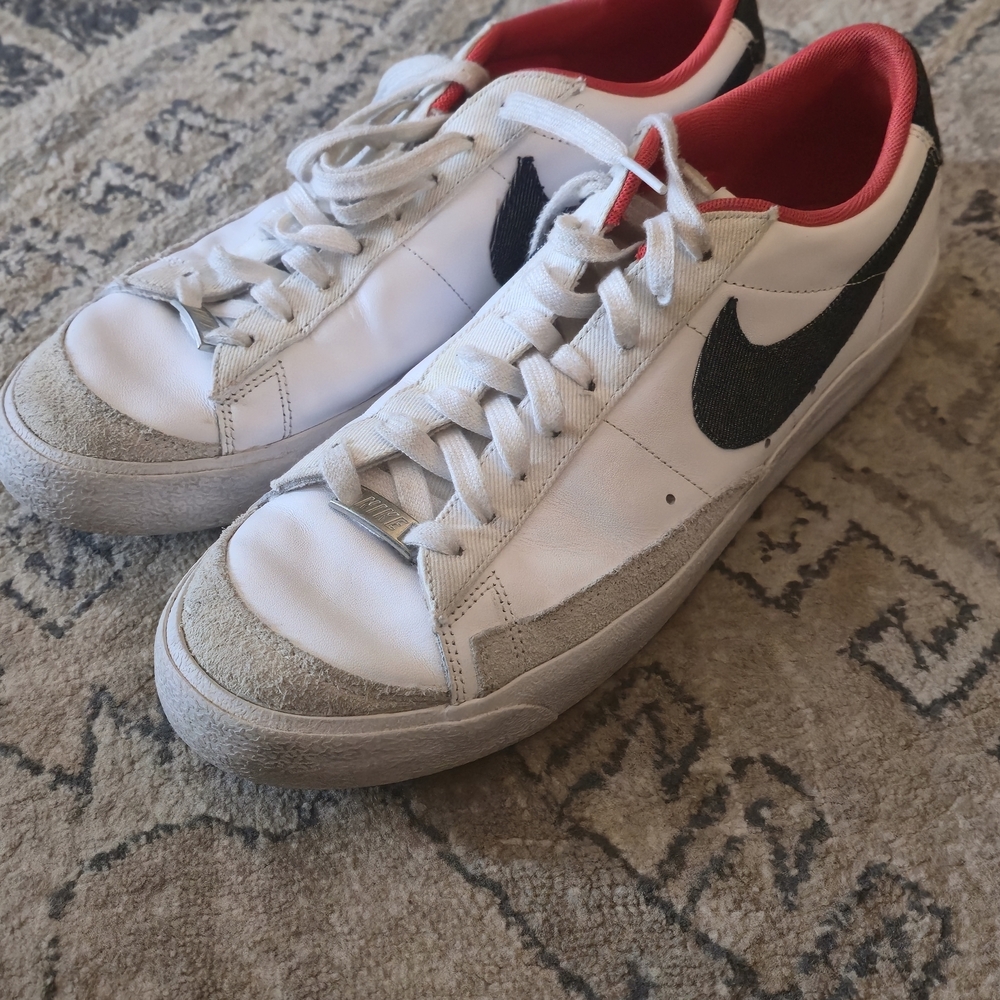Nike White Low-Top Sneakers with Black Swoosh and Red Lining